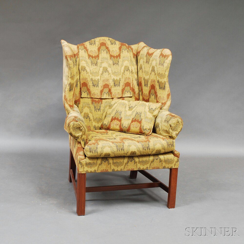 Appraisal: Chippendale-style Wing Chair the serpentine cresting and shaped ends joining