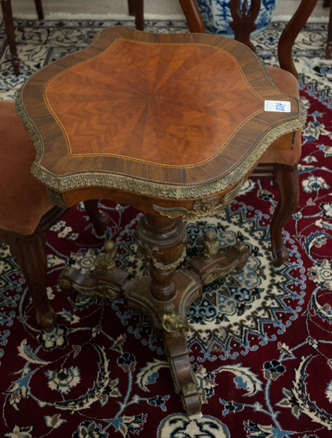 Appraisal: FRENCH EMPIRE STYLE GUERIDON OCCASIONAL TABLE having a serpentine parquet