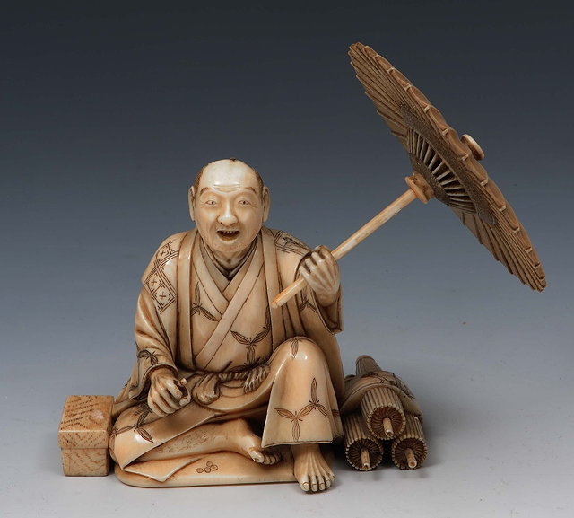 Appraisal: A Japanese ivory okimono of a street vendorMeiji periodsigned Seizan