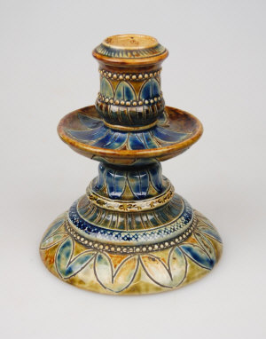 Appraisal: A th century Doulton Lambeth stoneware candlestick traditionally decorated on