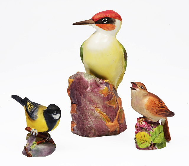 Appraisal: A ROYAL WORCESTER BONE CHINA FIGURINE OF A GREEN WOODPECKER