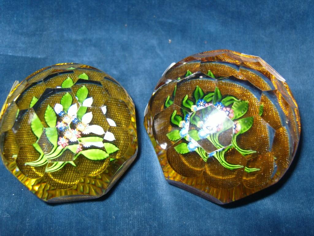 Appraisal: Two graduated yellow ground paperweights with circular and hexagonal faceted