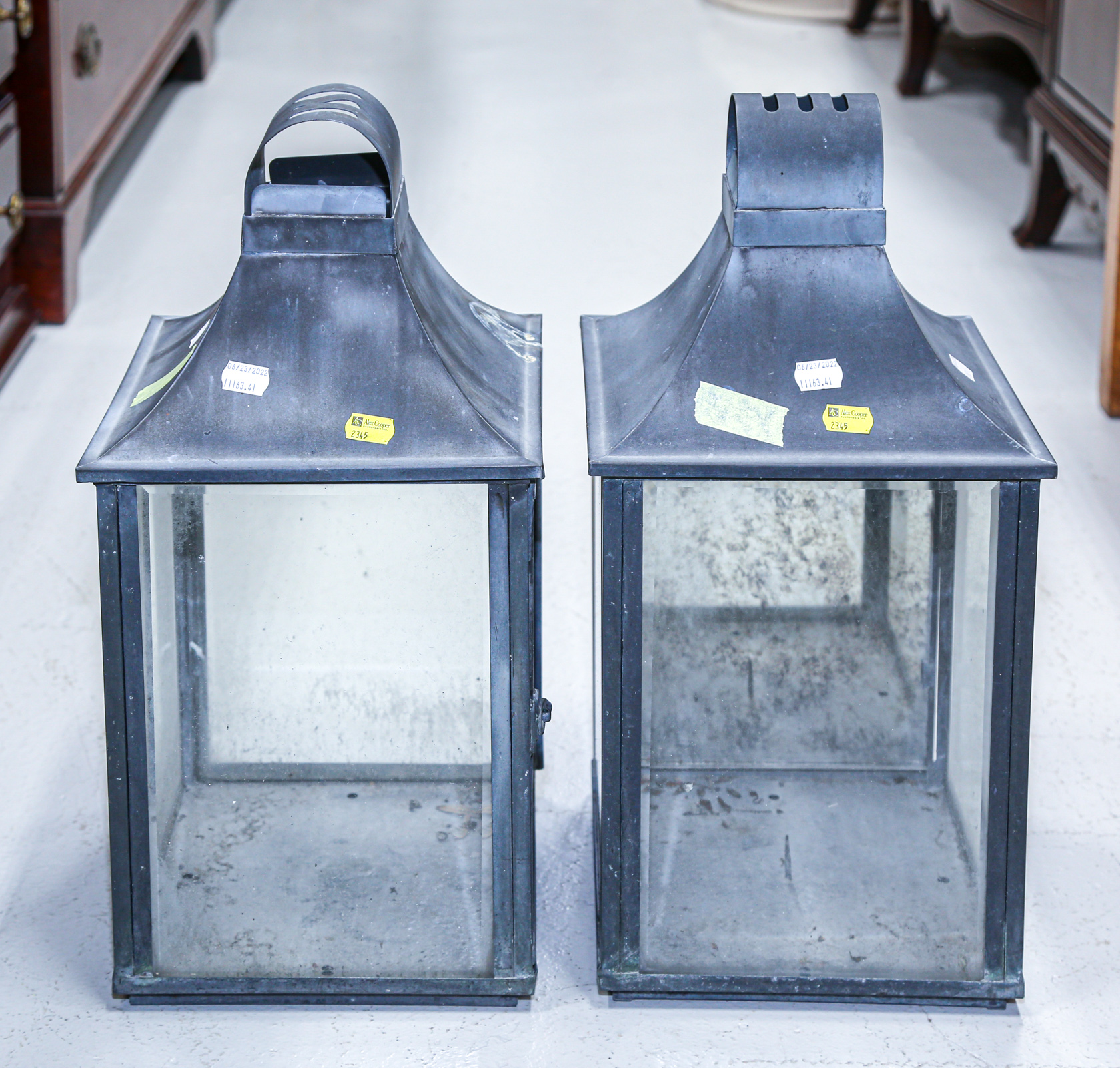 Appraisal: A PAIR OF METAL PORCH CANDLE LANTERNS Approximately in H