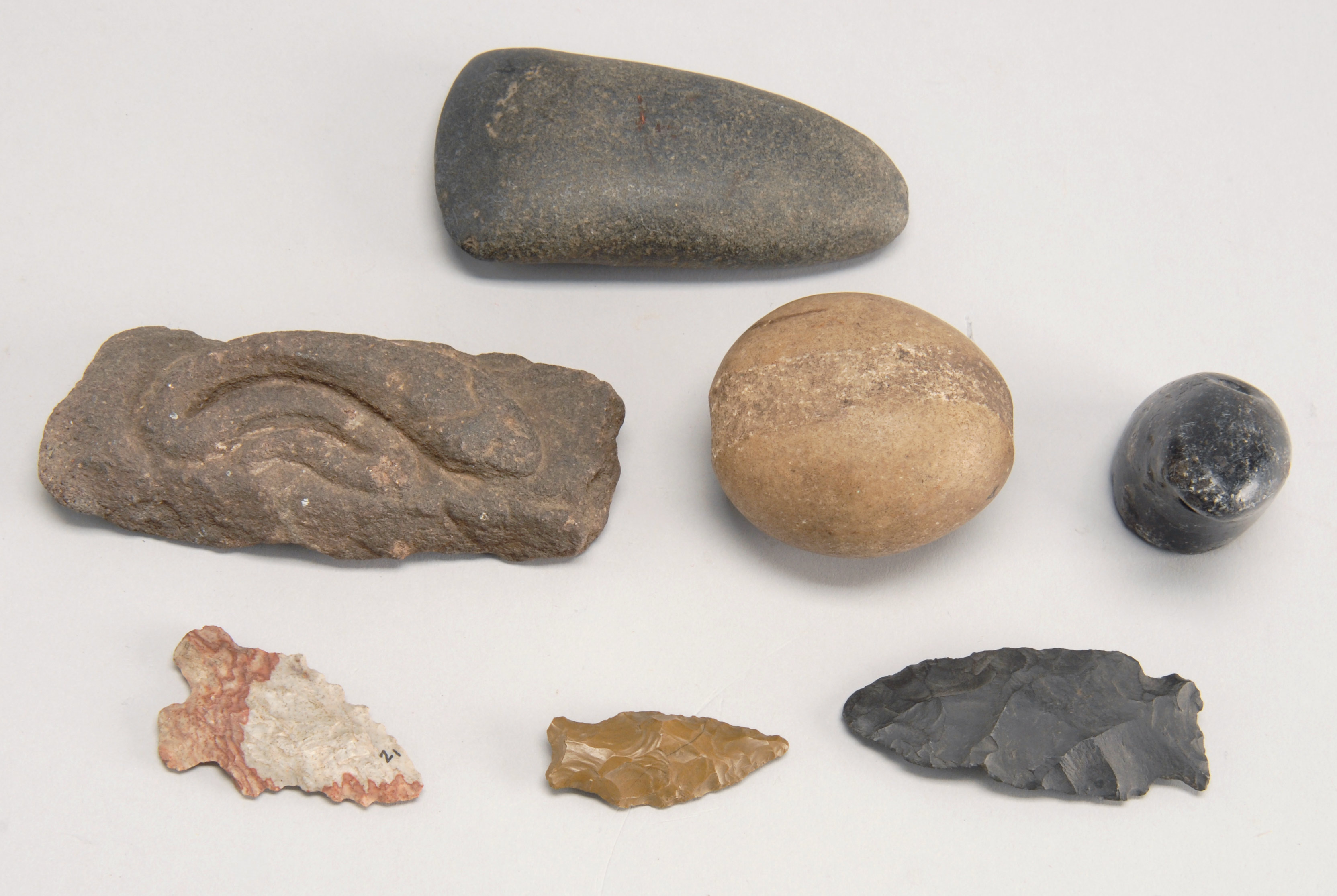 Appraisal: SEVEN AMERICAN NATIVE ARTIFACTS A pipe bowl three arrowheads a