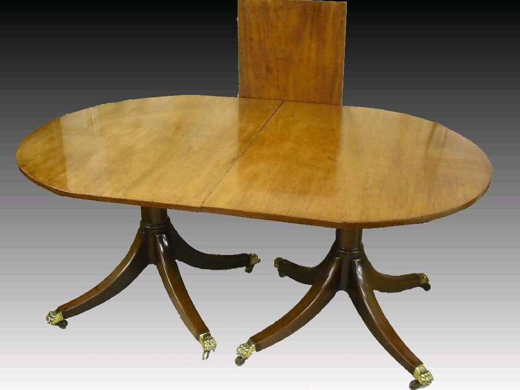 Appraisal: George III oval mahogany twin pedestal extending dining table each