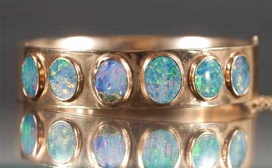 Appraisal: Lady's K yellow gold and black opal bangle bracelet grams