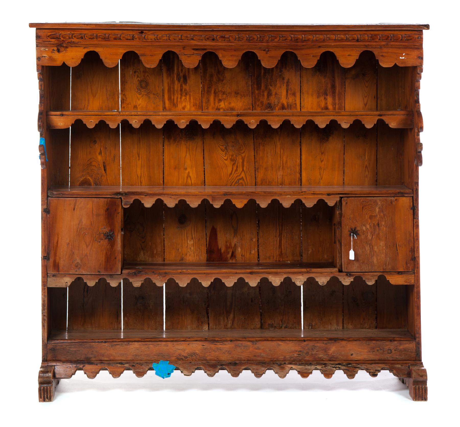 Appraisal: EUROPEAN OPEN CUPBOARD Possibly Spain mid th century pine Scalloped