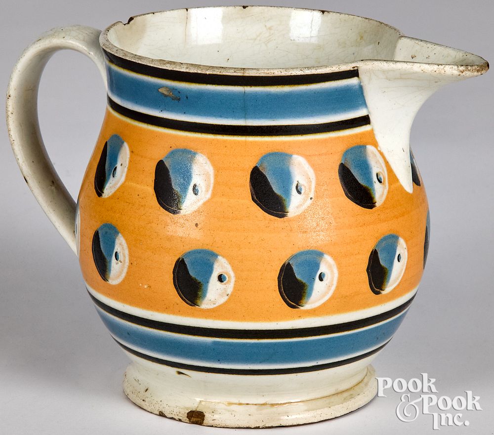 Appraisal: Mocha pitcher with cat's-eye decoration Mocha pitcher with cat's-eye decoration