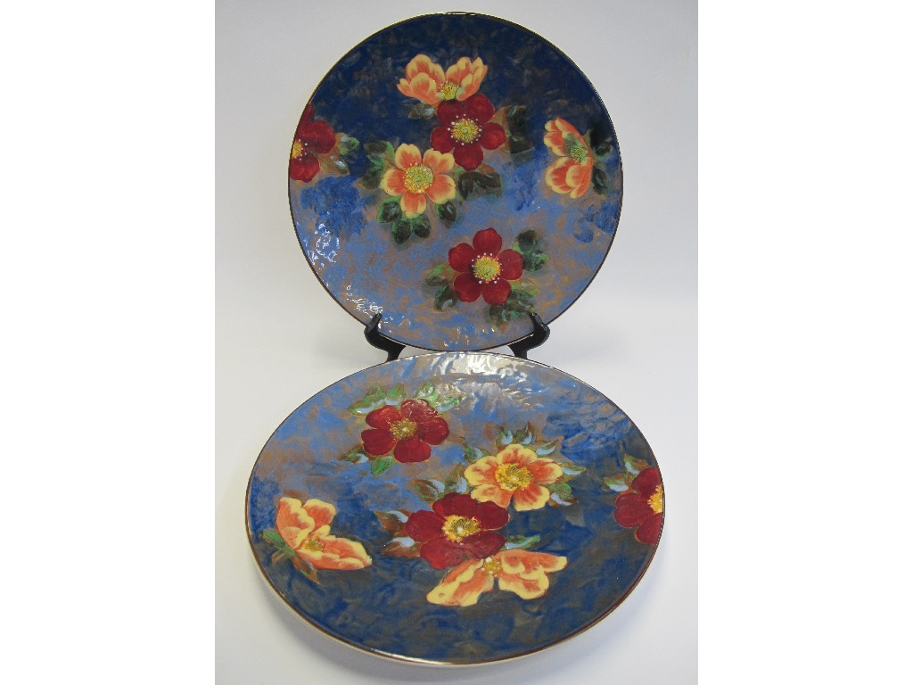 Appraisal: Two large Royal Doulton chargers decorated with dog roses