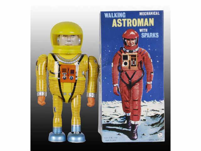 Appraisal: Tin Age Collection Walking Astroman Toy w Box Description Yellow