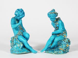 Appraisal: Pair of Sevres style porcelain turquoise glazed figures depicting Cupid