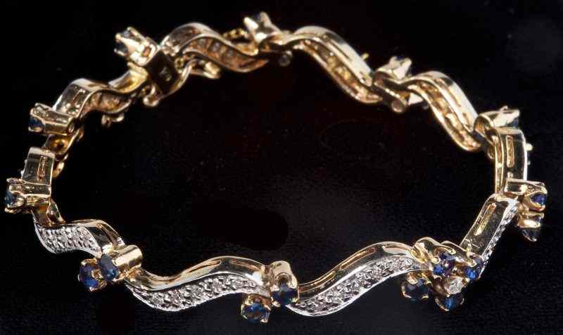 Appraisal: Diamond and Sapphire Braceletdesigned in yellow and white gold and