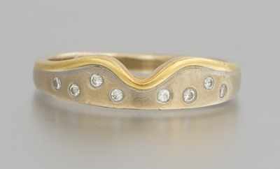 Appraisal: A Two Tone Gold and Diamond Band k and k