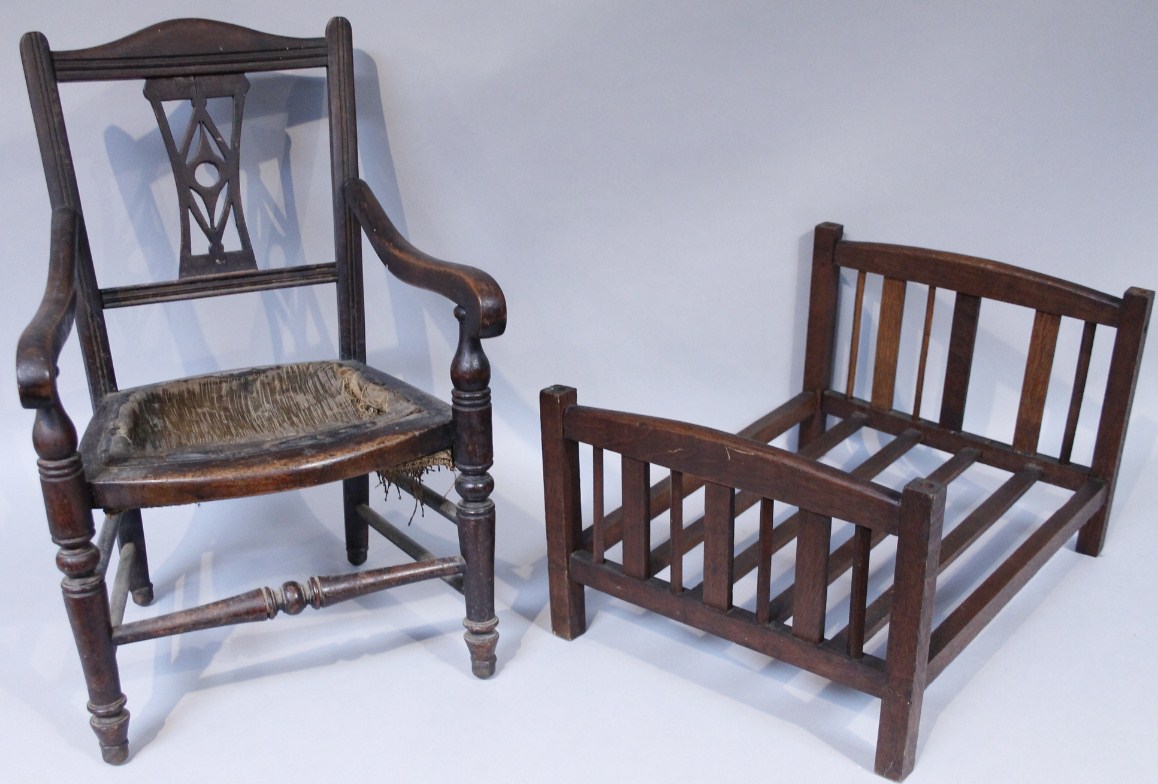 Appraisal: An early Edwardian style child's mahogany carver chair with an