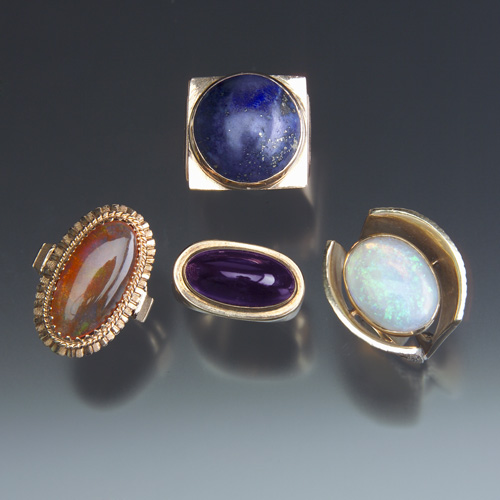 Appraisal: MODERN Four gold rings with gemstone cabochons k yellow or