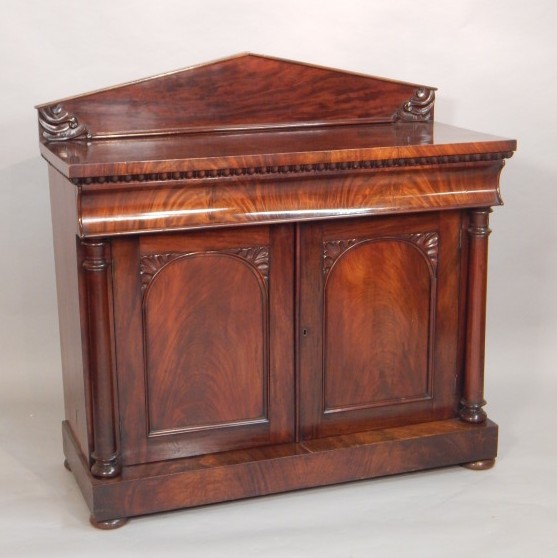 Appraisal: A Victorian figured mahogany chiffonnier the raised arch back carved