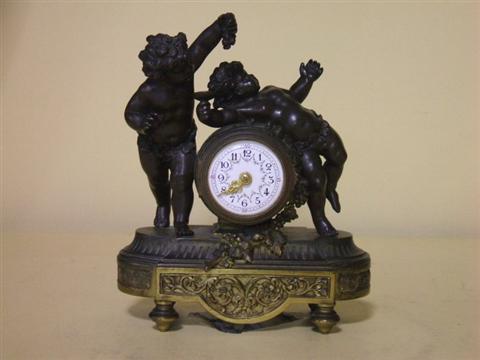 Appraisal: FRENCH PARCEL-GILT BRONZE FIGURAL CLOCK In the Louis XVI style