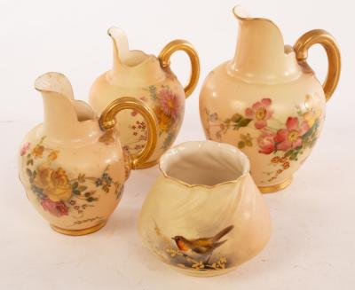 Appraisal: Two Royal Worcester blush ivory jugs painted polychrome flowers cm