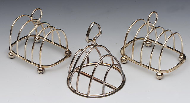 Appraisal: A PAIR OF GEORGE V SILVER FOUR DIVISION TOAST RACKS