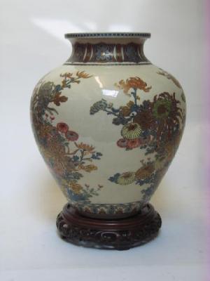 Appraisal: A JAPANESE EARTHENWARE SATSUMA BALUSTER VASE Meiji Period of ovoid