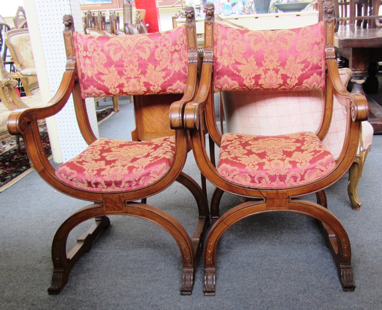 Appraisal: A pair of late th century Spanish walnut Savonarola chairs