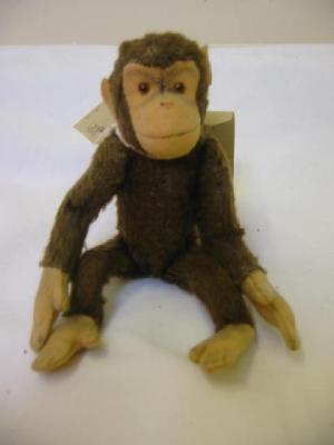 Appraisal: A small monkey doll straw filled covered in brown plush