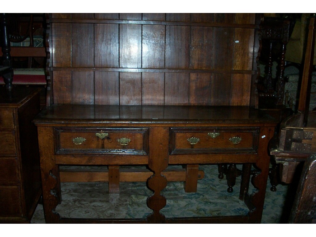 Appraisal: An th century and later oak dresser fitted with two