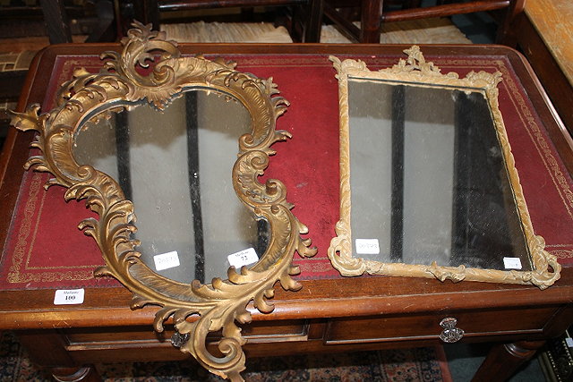 Appraisal: A CONTINENTAL CARVED GILTWOOD ASYMMETRIC WALL MIRROR circa cm x