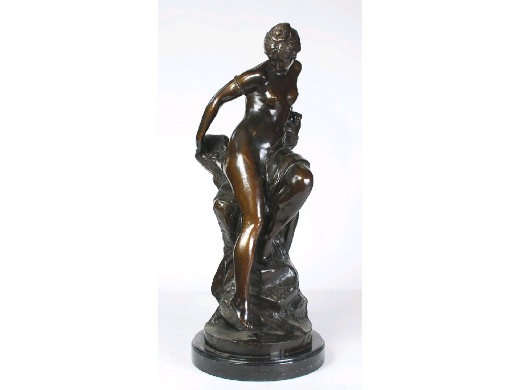 Appraisal: BRONZE FIGURE OF A NAKED MAIDEN AFTER THE ORIGINAL BY