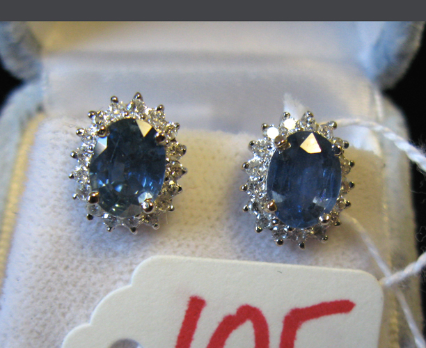 Appraisal: PAIR OF SAPPHIRE DIAMOND AND FOURTEEN KARAT WHITE GOLD EAR