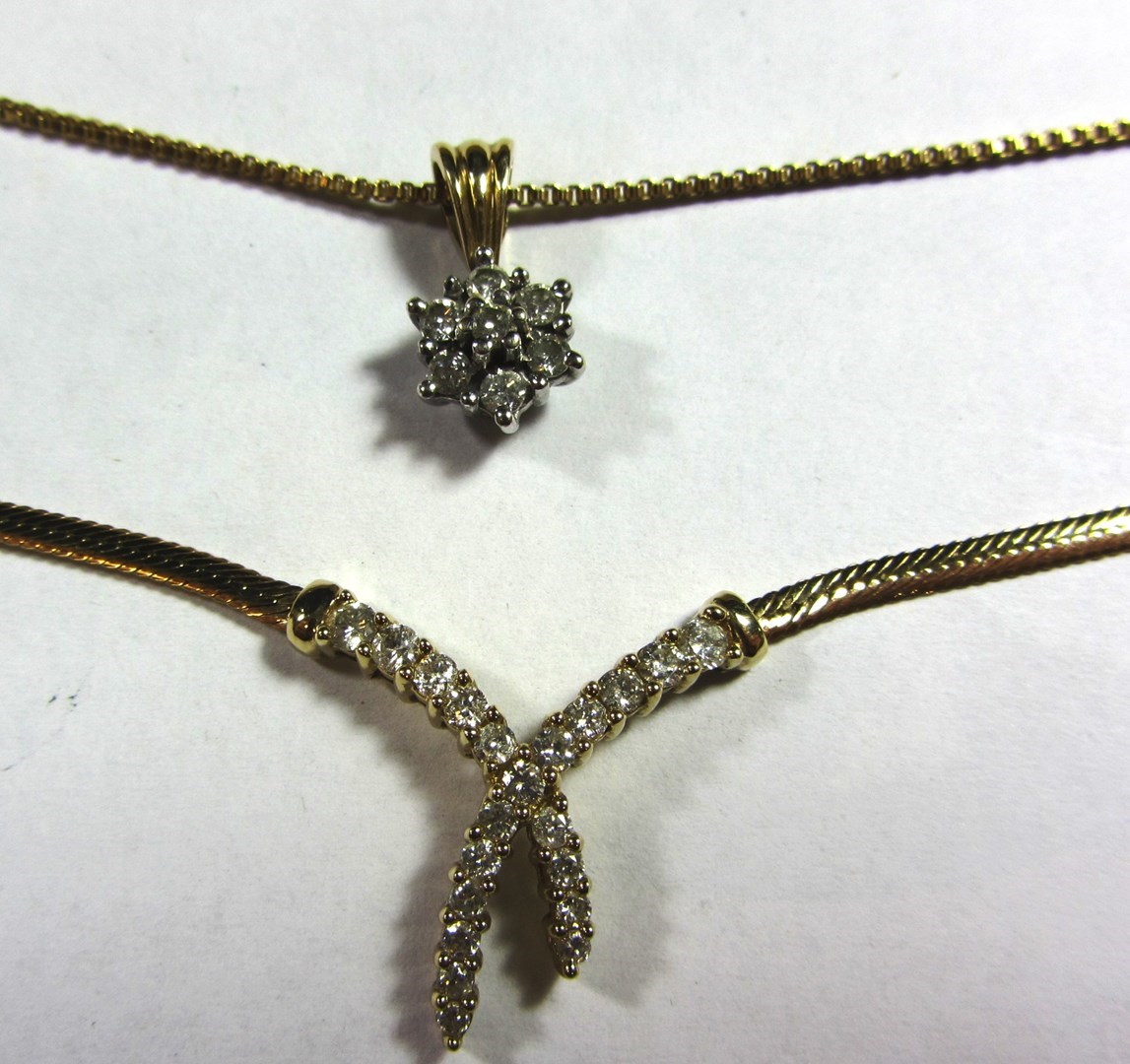 Appraisal: A ct gold and diamond set necklace the front in