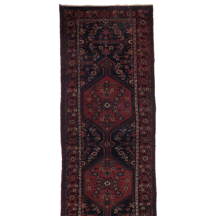 Appraisal: Northwest Persian runner c stylized floral design on a red