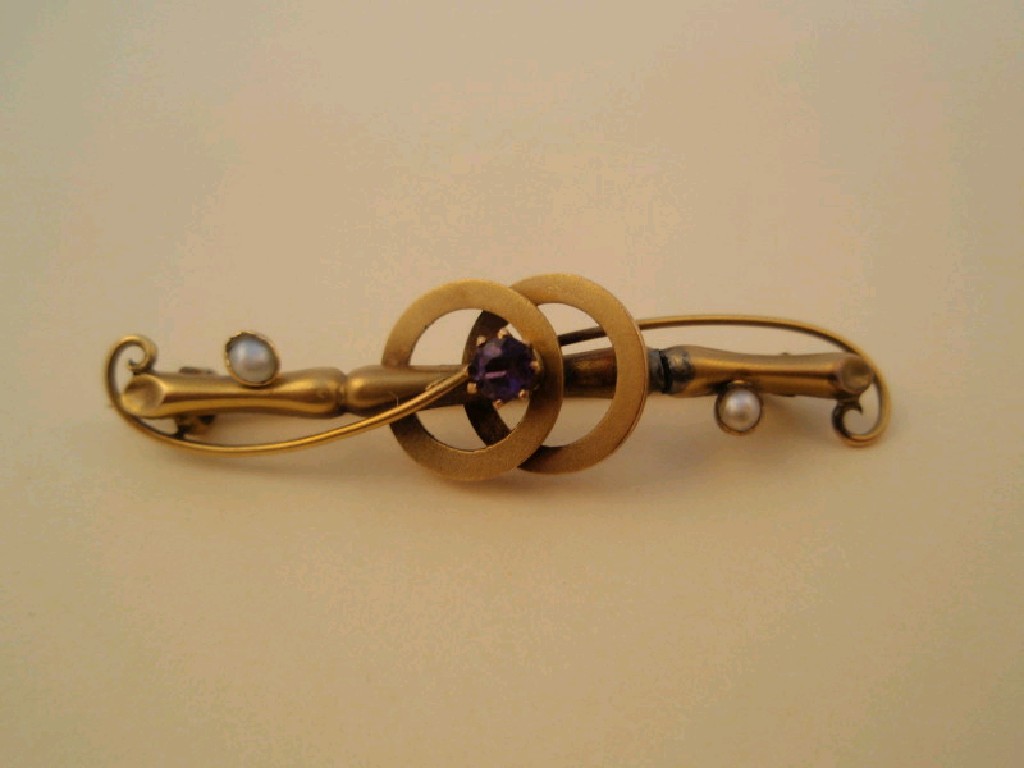 Appraisal: A Victorian bar brooch set with a small amethyst and