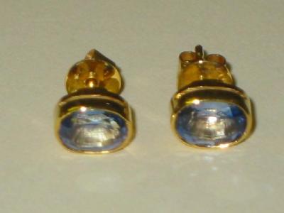 Appraisal: A PAIR OF SAPPHIRE EAR STUDS the pale blue oval