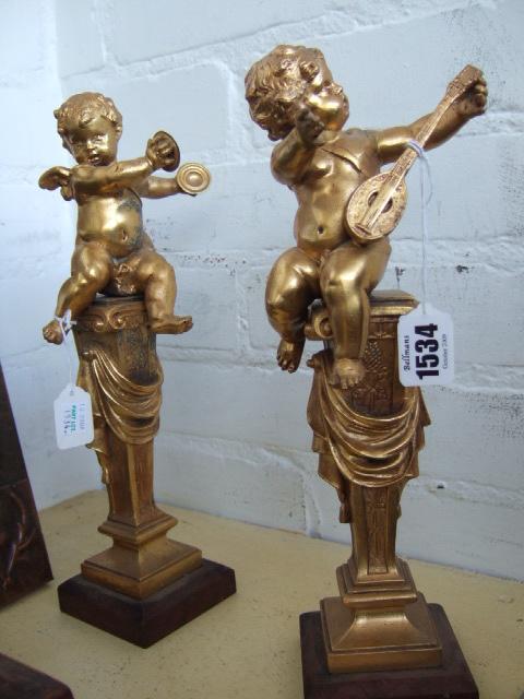 Appraisal: A pair of gilt metal garnitures th century modelled as