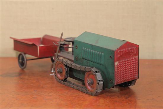 Appraisal: STRUCTO TRACTOR Pressed steel tractor wind up toy with chain