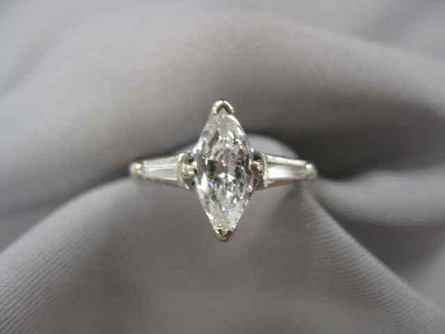 Appraisal: Diamond Solitaire Ring marquis cut with baguette on each side