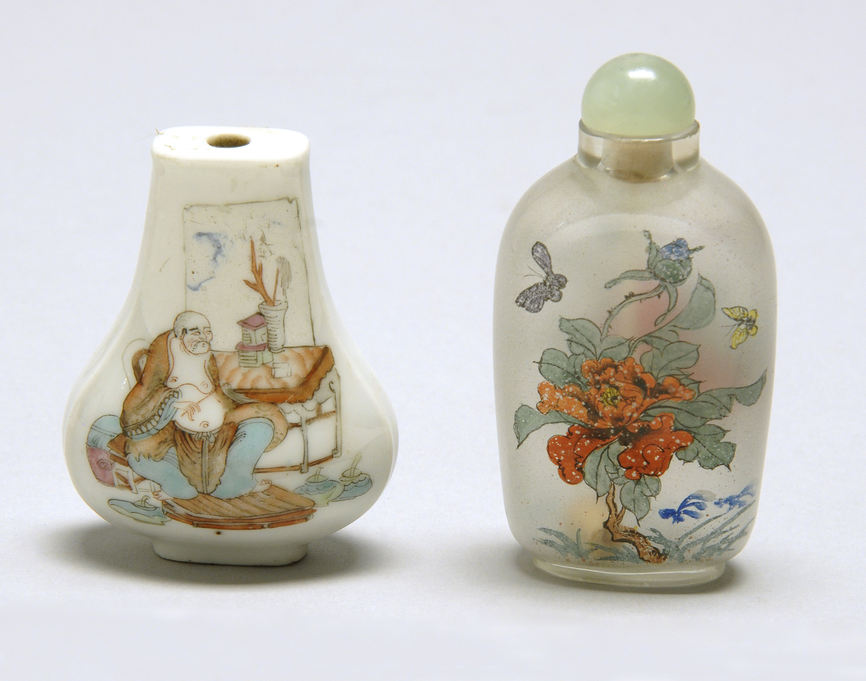 Appraisal: TWO SNUFF BOTTLES Early th Century Interior-painted glass bottle in