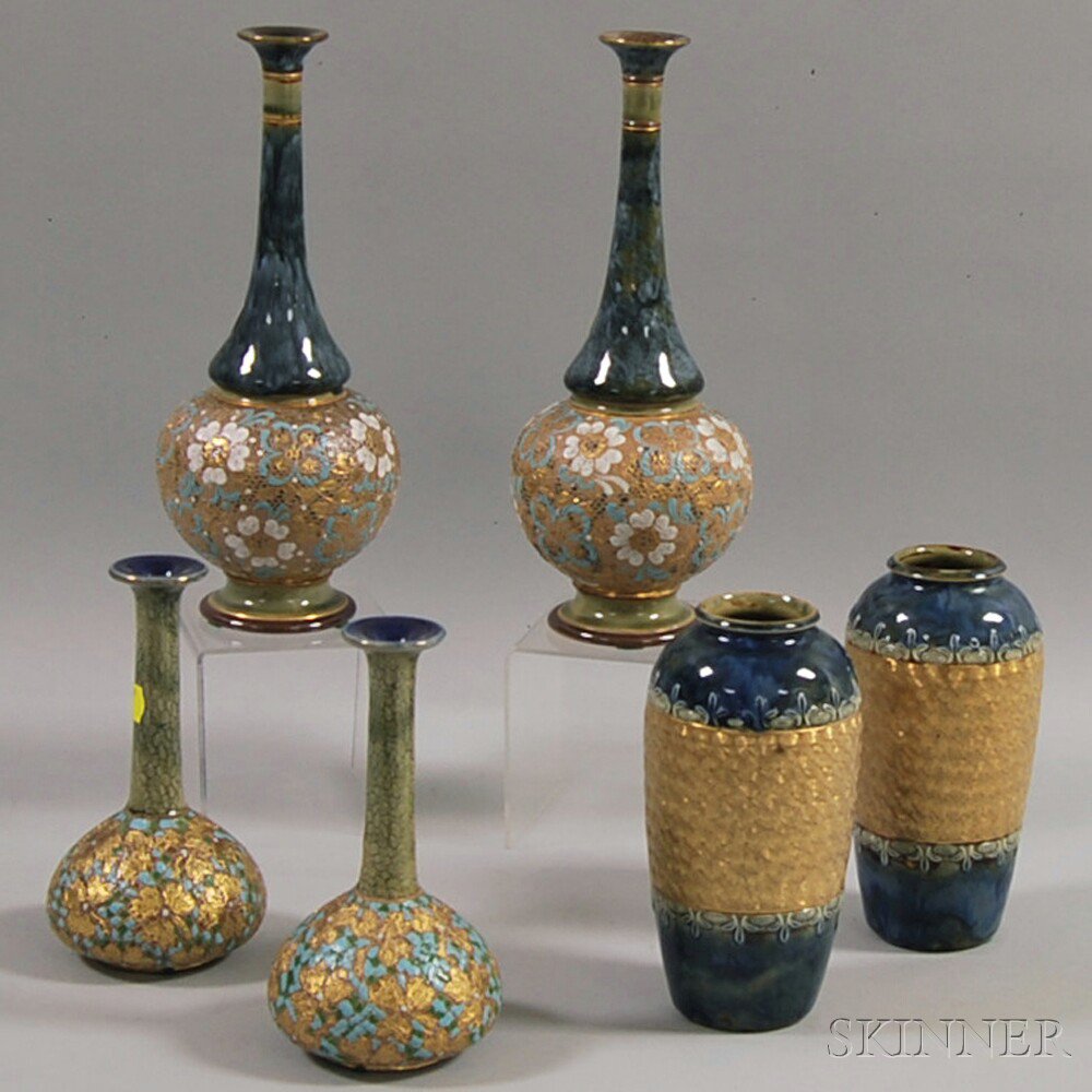 Appraisal: Three Pairs of Royal Doulton Parcel-gilt Stoneware Vases England early