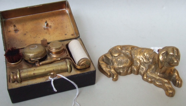 Appraisal: A brass and leather bound travelling desk set early th