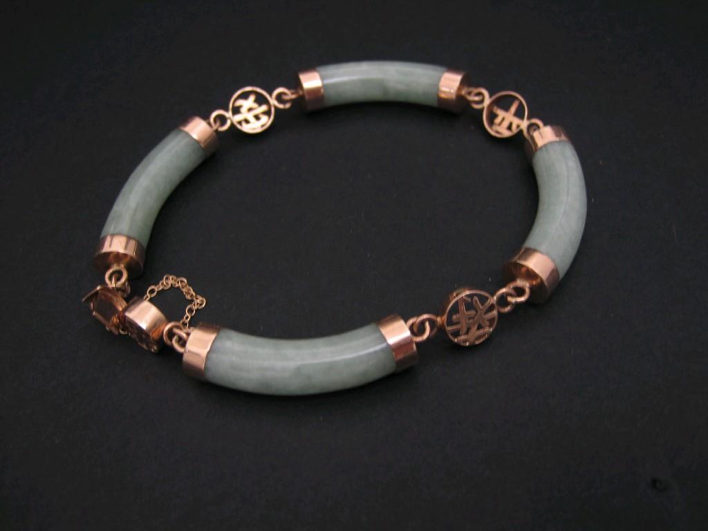 Appraisal: A Jade Bracelet of four curved batons with mounts and