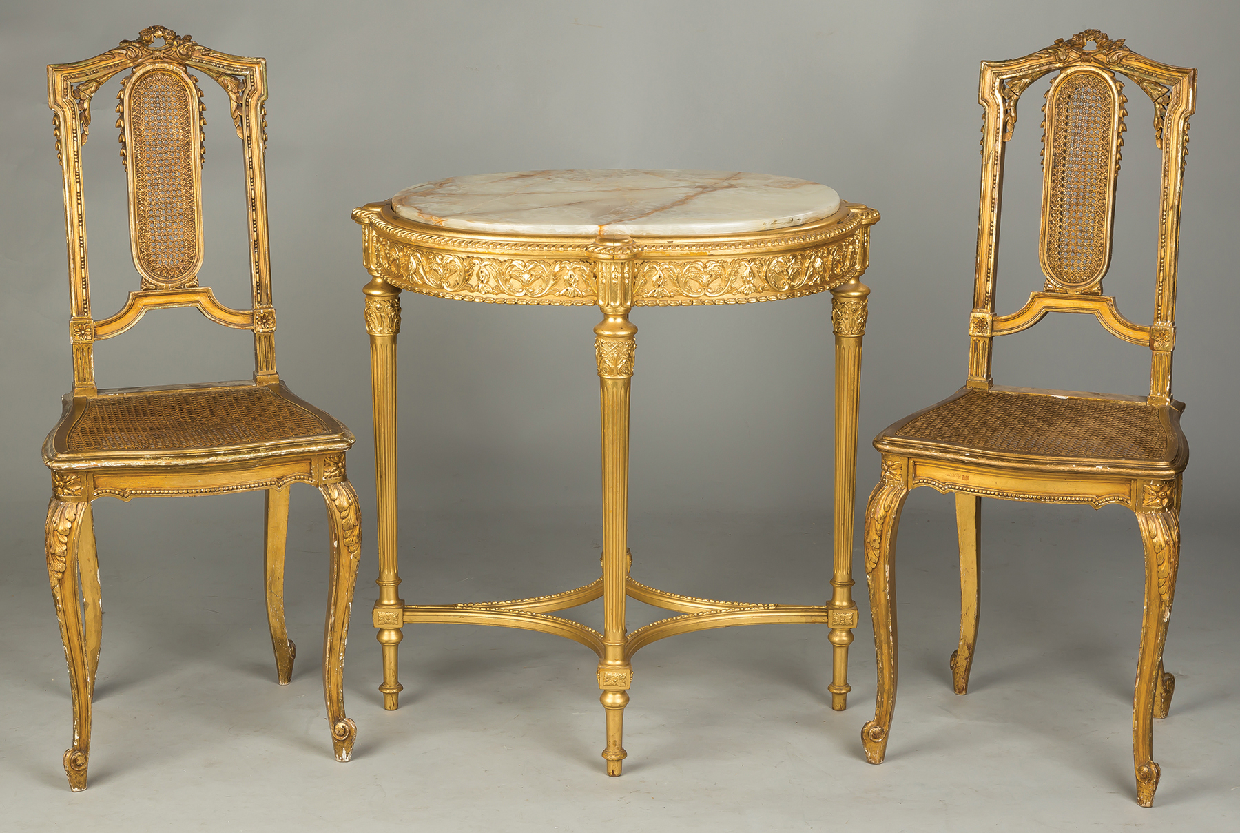 Appraisal: French Carved and Gilt Wood Chairs and Side Table Pair