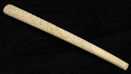 Appraisal: JAPANESE CARVED IVORY BATON The tapered shaft relief carved with