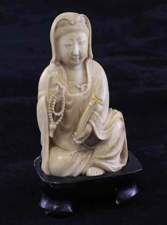 Appraisal: A Chinese ivory seated figure of Guanyin th early th