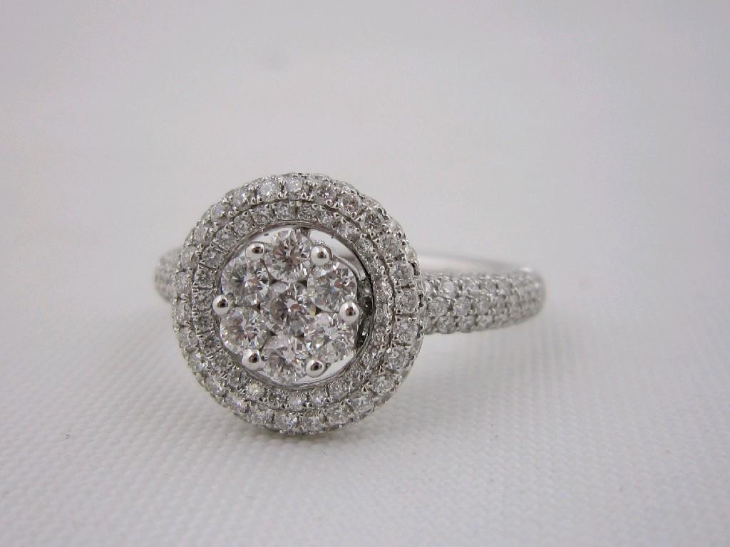 Appraisal: A Diamond Cluster Ring pav-set seven brilliant-cut stones within an