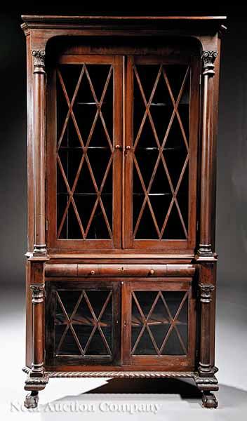 Appraisal: An American Carved Mahogany Corner Cupboard late th c molded