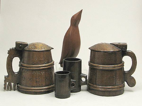 Appraisal: A pair of Russian carved wood tankards th century Each