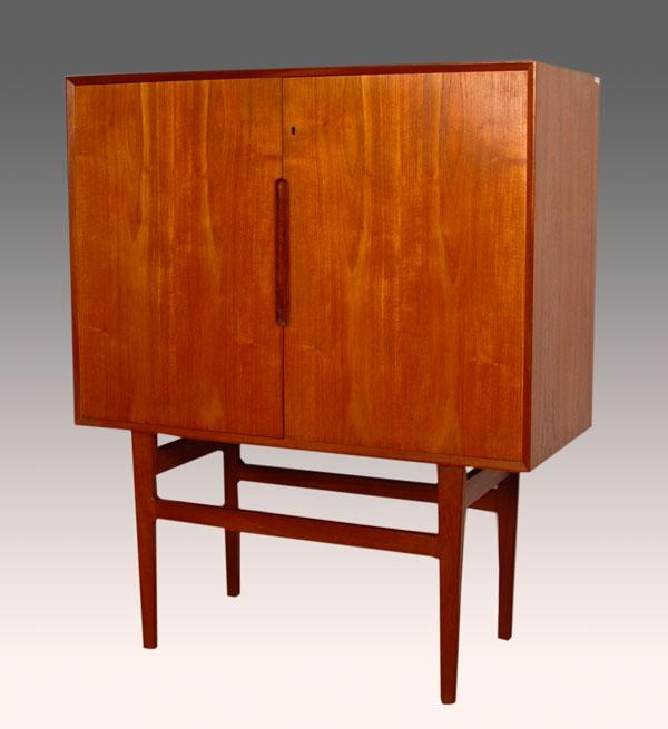 Appraisal: DANISH MODERN TWO DOOR CABINET ON TALL LEGS Fully compartmented