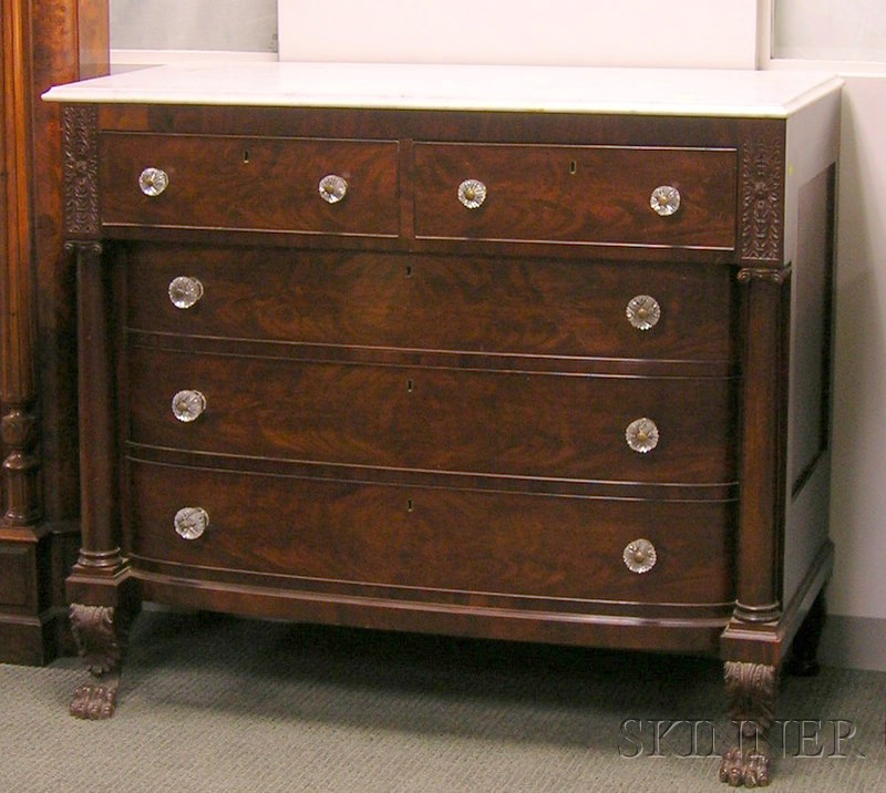 Appraisal: Empire White Marble-top Carved Mahogany and Mahogany Veneer Bowfront Bureau