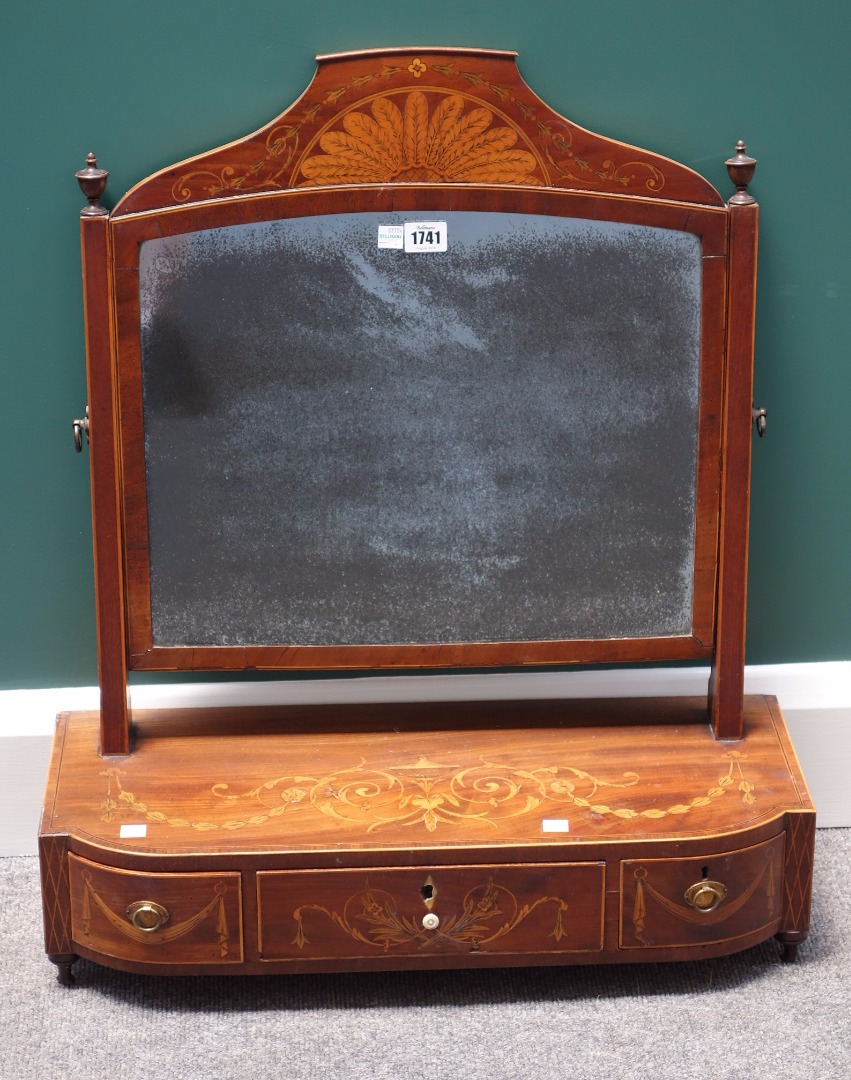 Appraisal: A Regency marquetry inlaid tulipwood banded toilet mirror with bow